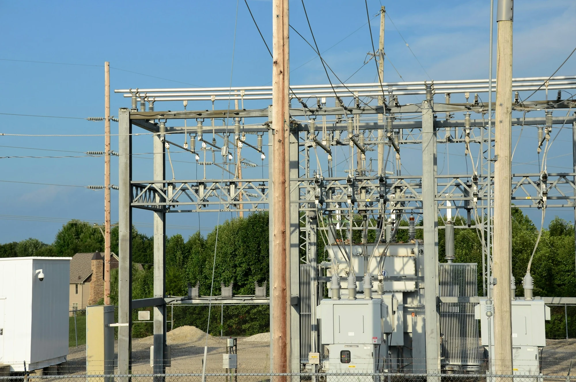 Power transformers and switching equipment at an electrical substation.